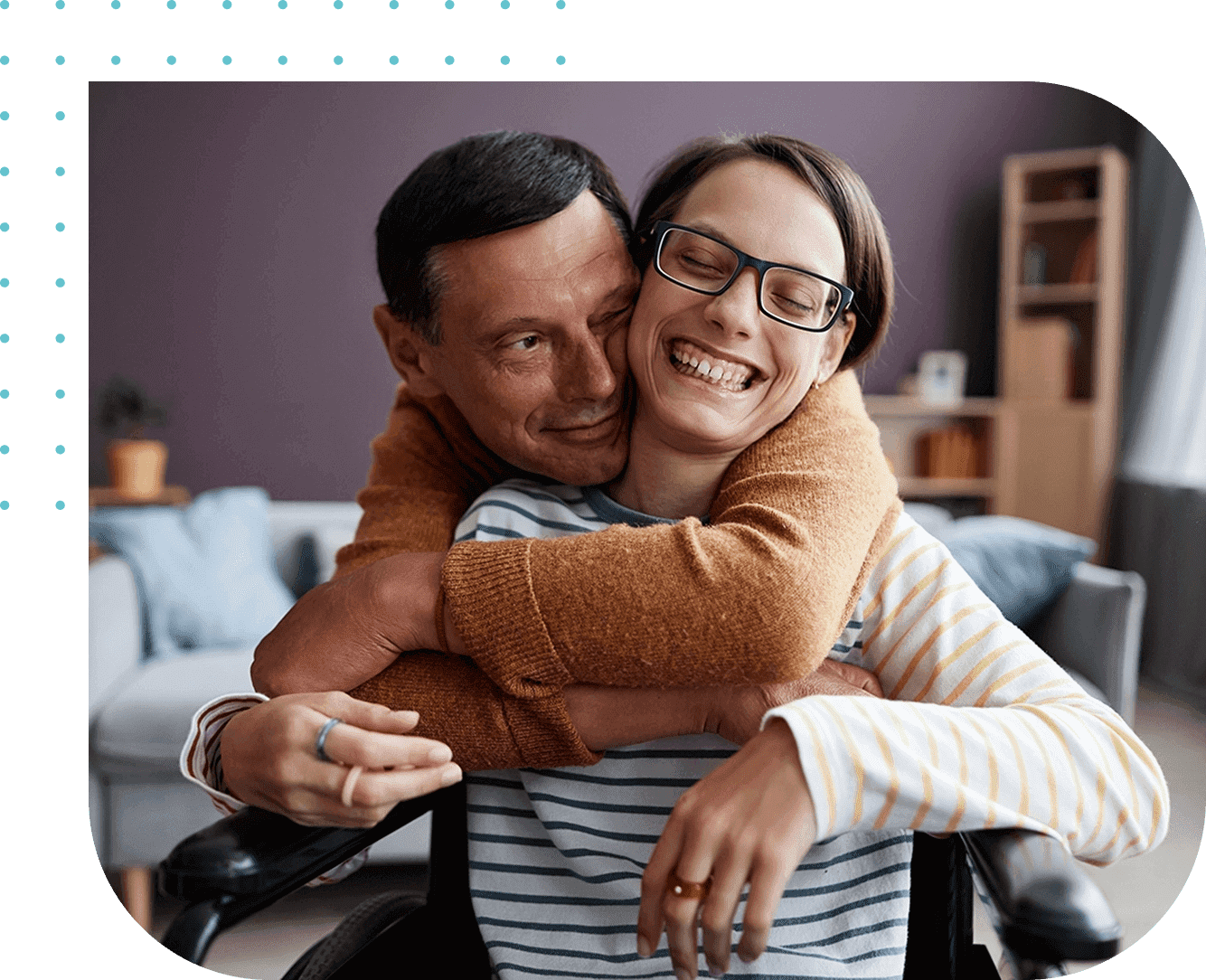 A man and woman hugging in a living room.