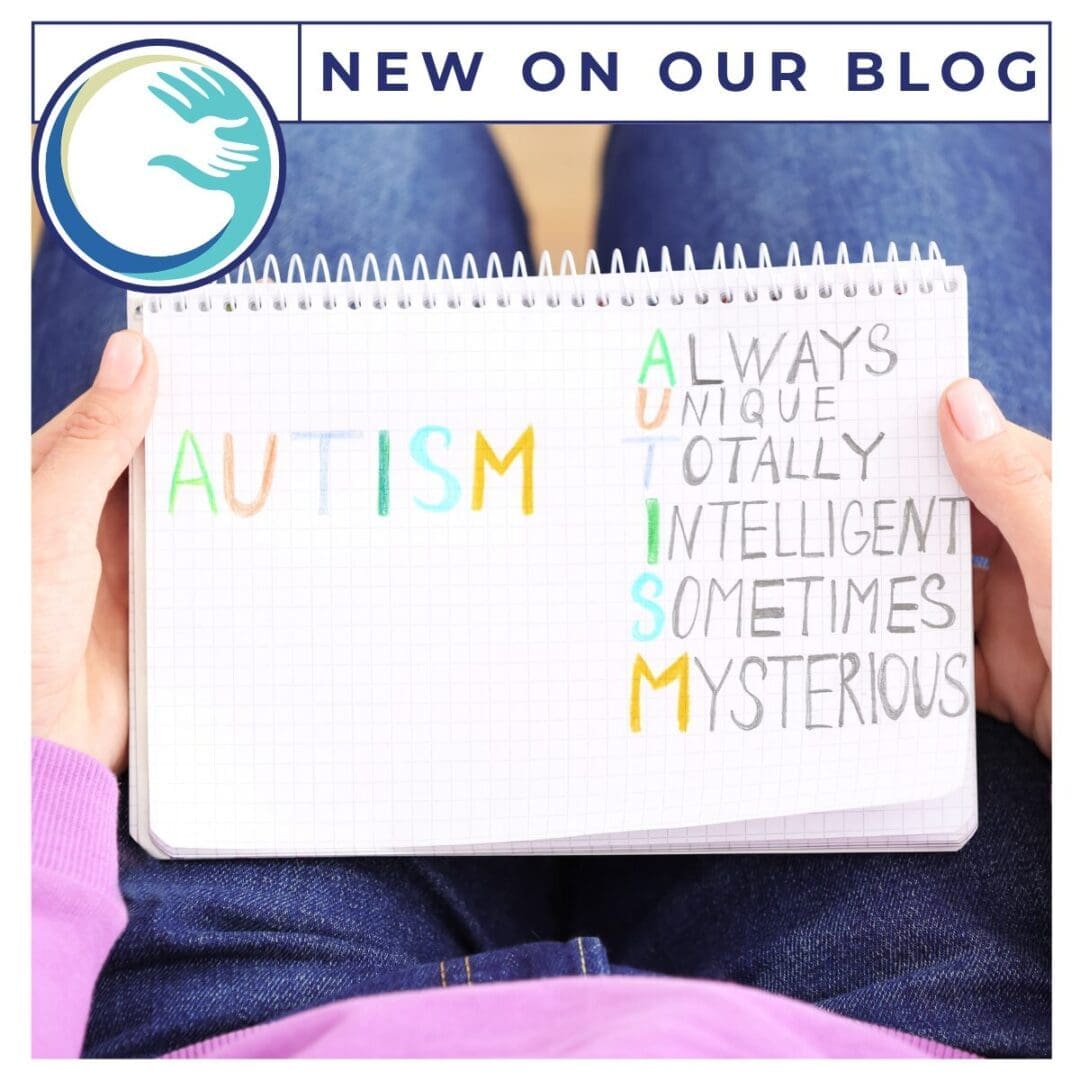 Notebook with autism acronym in colorful letters.