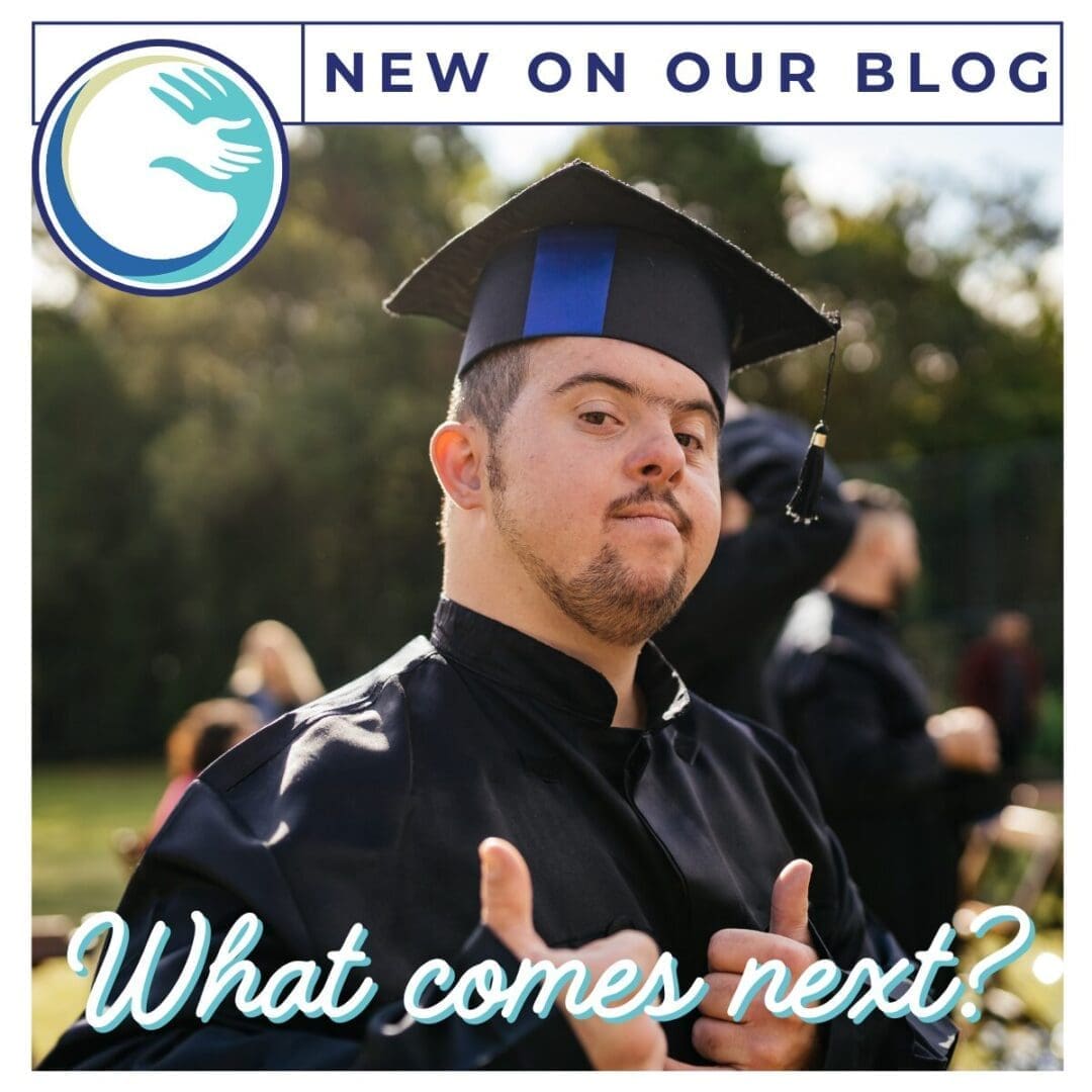 Graduate in cap and gown giving thumbs up