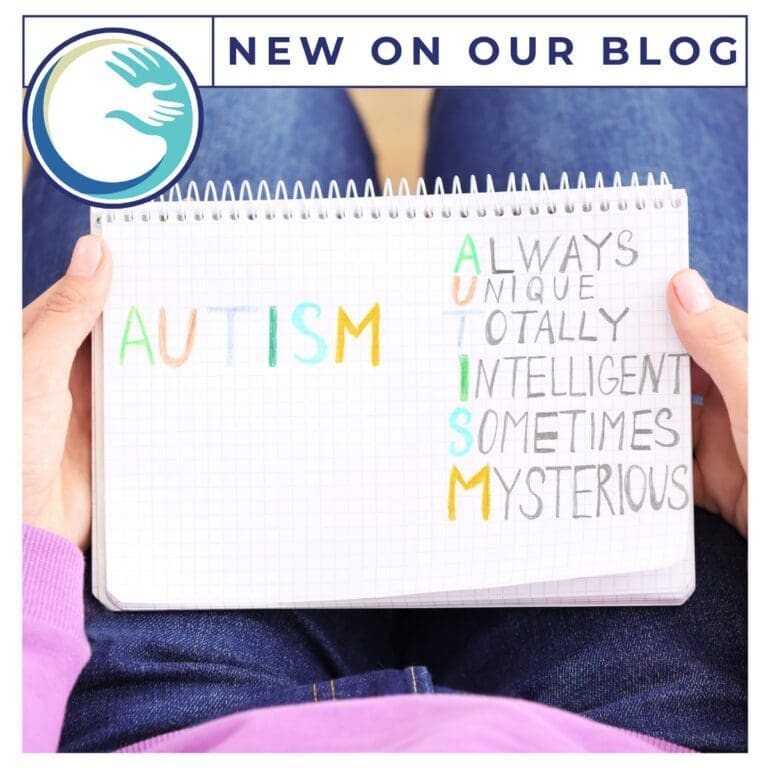 Notebook with autism acronym in colorful letters.