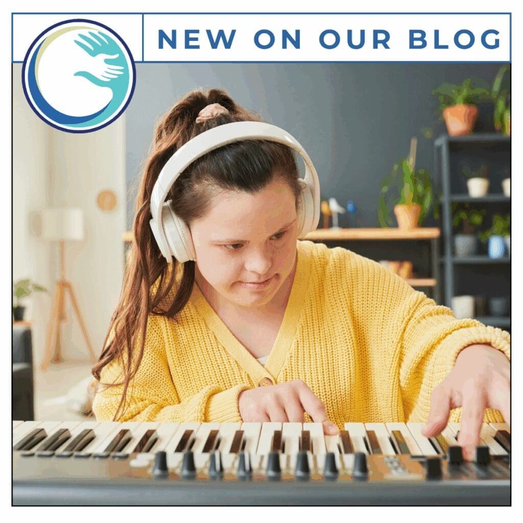 Person playing keyboard with headphones on.